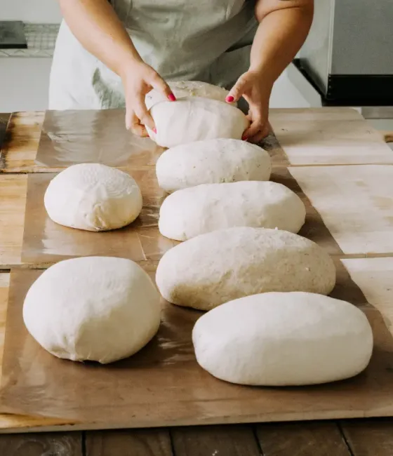 Elise shaping a batch of sourdough by hand.